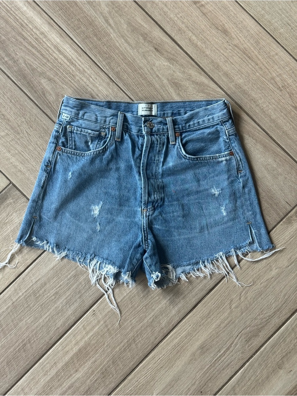 Citizens Of Humanity Distressed Denim Cutoff Shorts in Blue